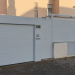 Nueva fachada con puerta de garaje  enrollable